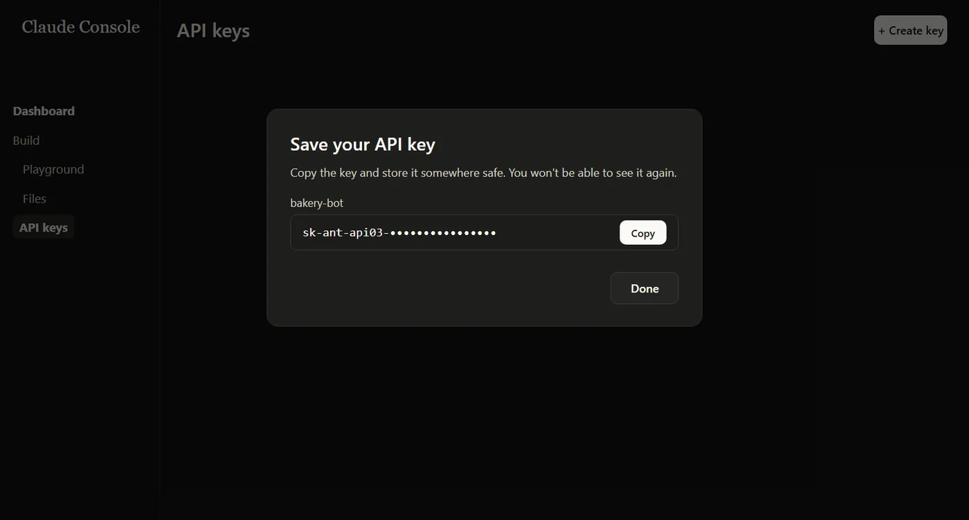 חלון Save your API key עם המפתח המוסתר חלקית, כפתור Copy וכפתור Done